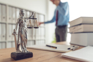 Attorney,Talking,On,Mobile,Device,In,Law,Office,,Selective,Focus
