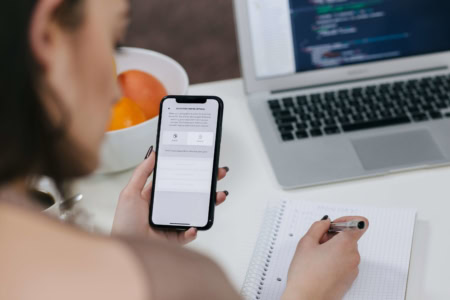 Business user using a mobile phone while working